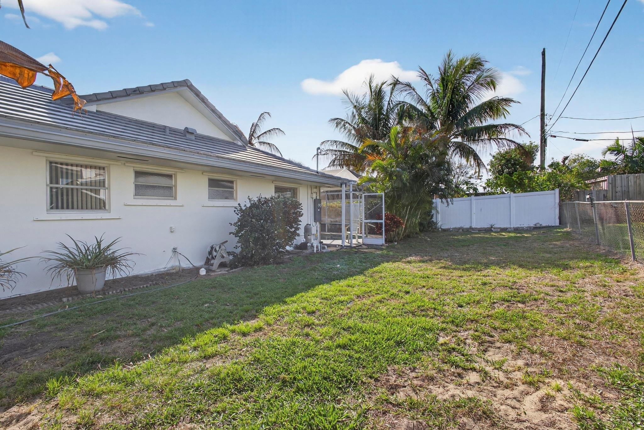 12753 Longford Road North Palm Beach, FL 33408 - Photo 53 of 68 a front view of house with yard and outdoor seating