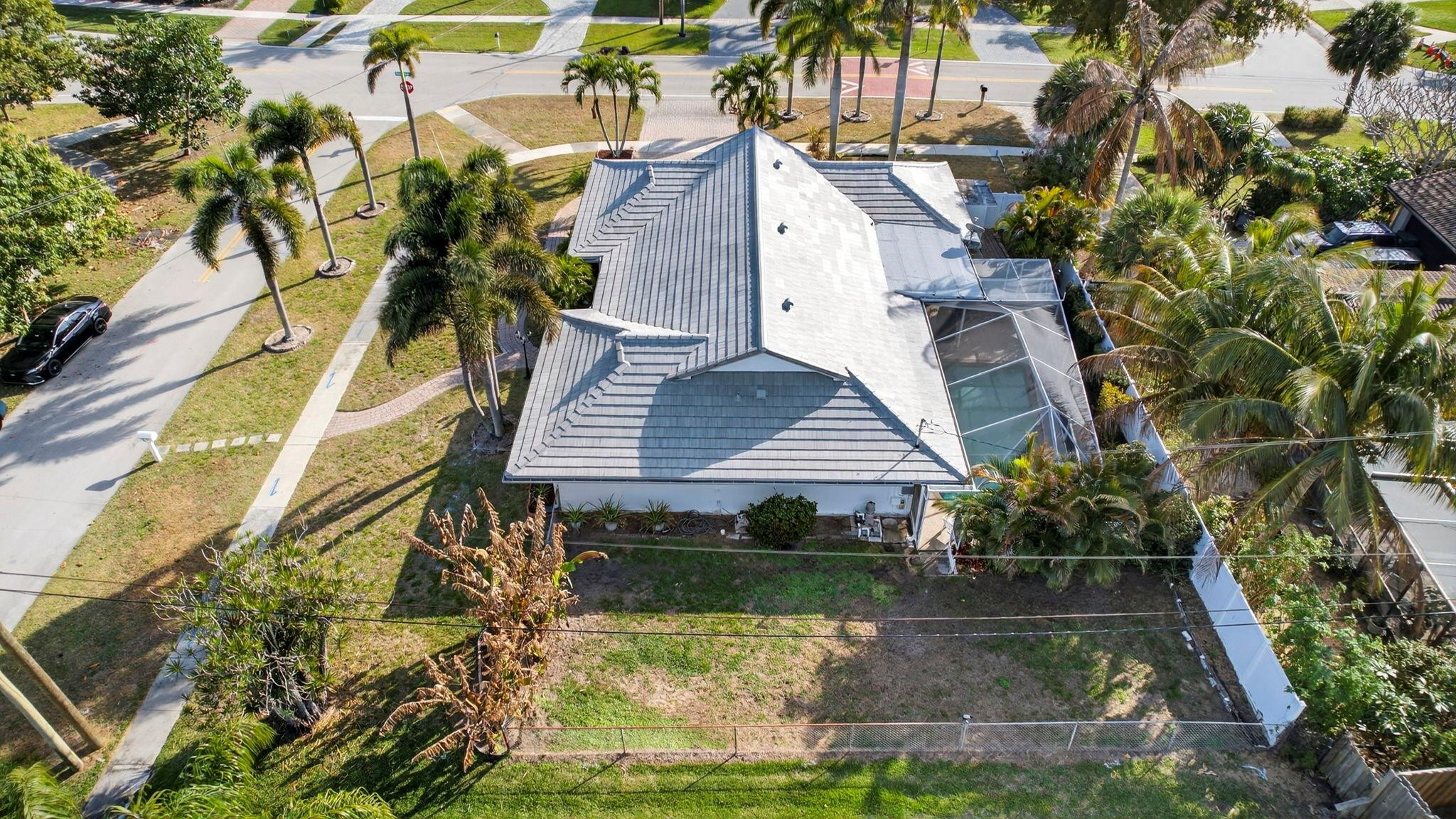 12753 Longford Road North Palm Beach, FL 33408 - Photo 54 of 68 a view of house with pool and sitting area
