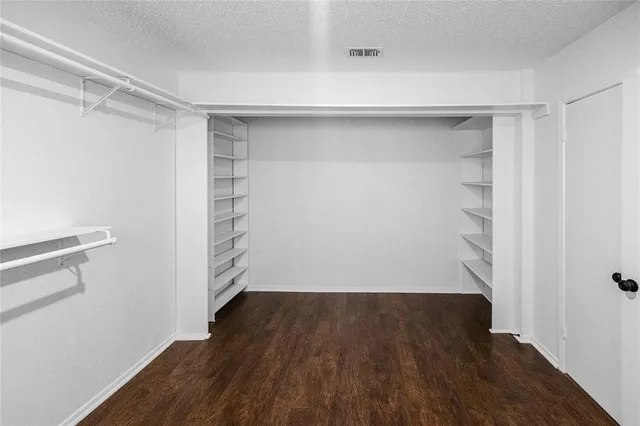 a view of an empty walk in closet