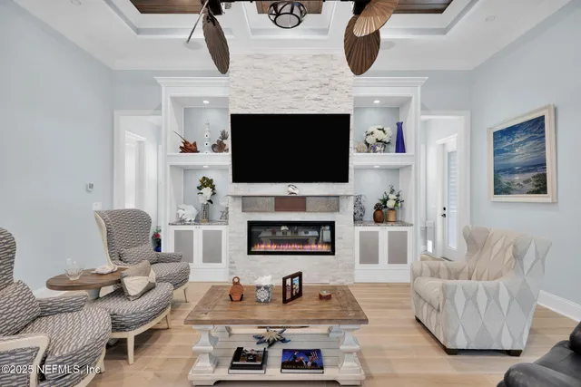 an aerial view of residential houses with outdoor space and lake view