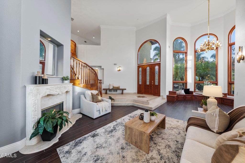43650 Camaron Road Temecula, CA 92590 - Photo 11 of 52 a living room with fireplace furniture and a large window