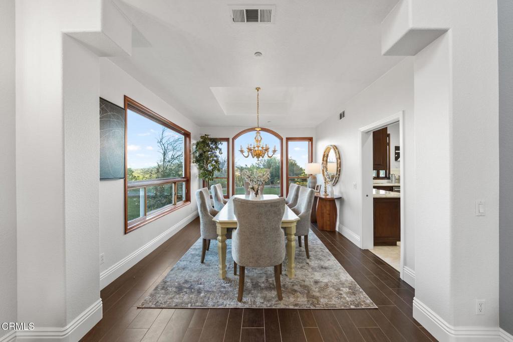 43650 Camaron Road Temecula, CA 92590 - Photo 12 of 52 a dining room with wooden floor and a rug