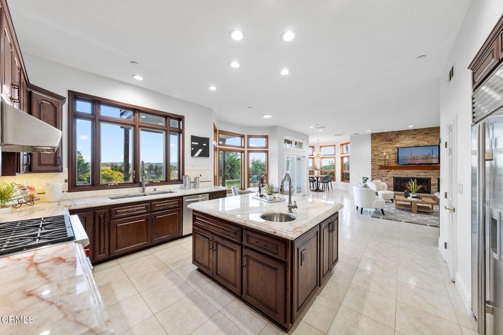 43650 Camaron Road Temecula, CA 92590 - Photo 13 of 52 a large white kitchen with a large window and a counter top space