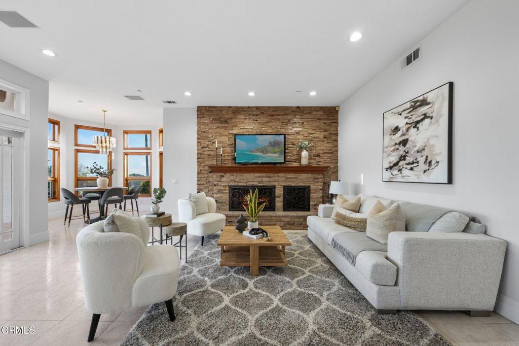 43650 Camaron Road Temecula, CA 92590 - Photo 17 of 52 a living room with furniture and a fireplace