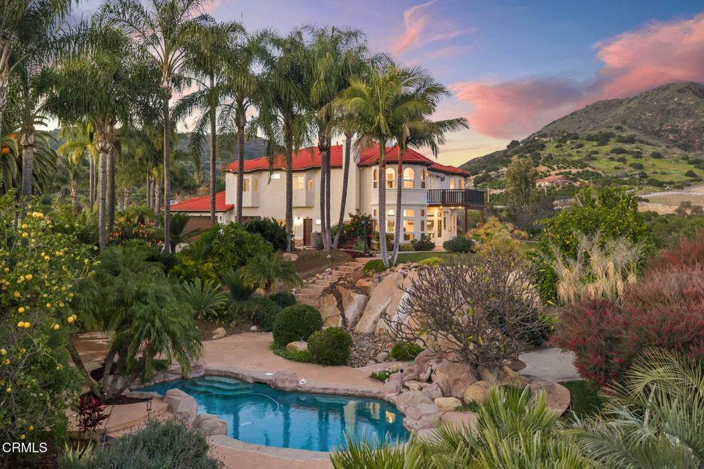 43650 Camaron Road Temecula, CA 92590 - Photo 2 of 52 a view of a garden with a building in the background