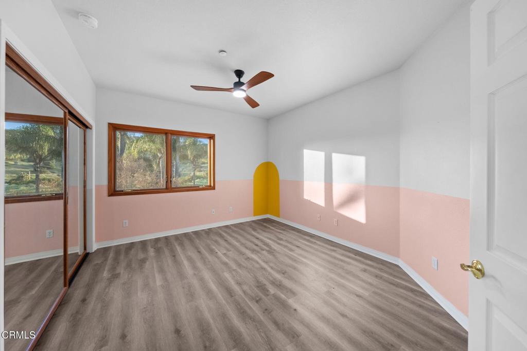 43650 Camaron Road Temecula, CA 92590 - Photo 26 of 52 a view of empty room with wooden floor and fan