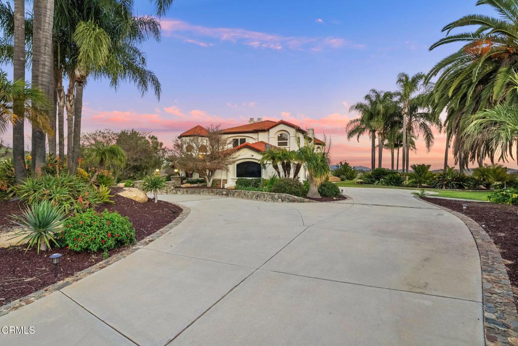 43650 Camaron Road Temecula, CA 92590 - Photo 3 of 52 a front view of a house with a yard and a garage