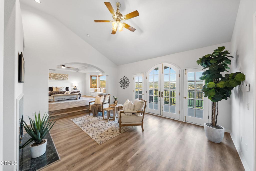 43650 Camaron Road Temecula, CA 92590 - Photo 33 of 52 a living room with furniture and a large window with wooden floor