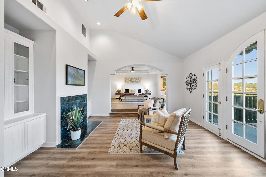 43650 Camaron Road Temecula, CA 92590 - Photo 34 of 52 a living room with furniture and a fireplace
