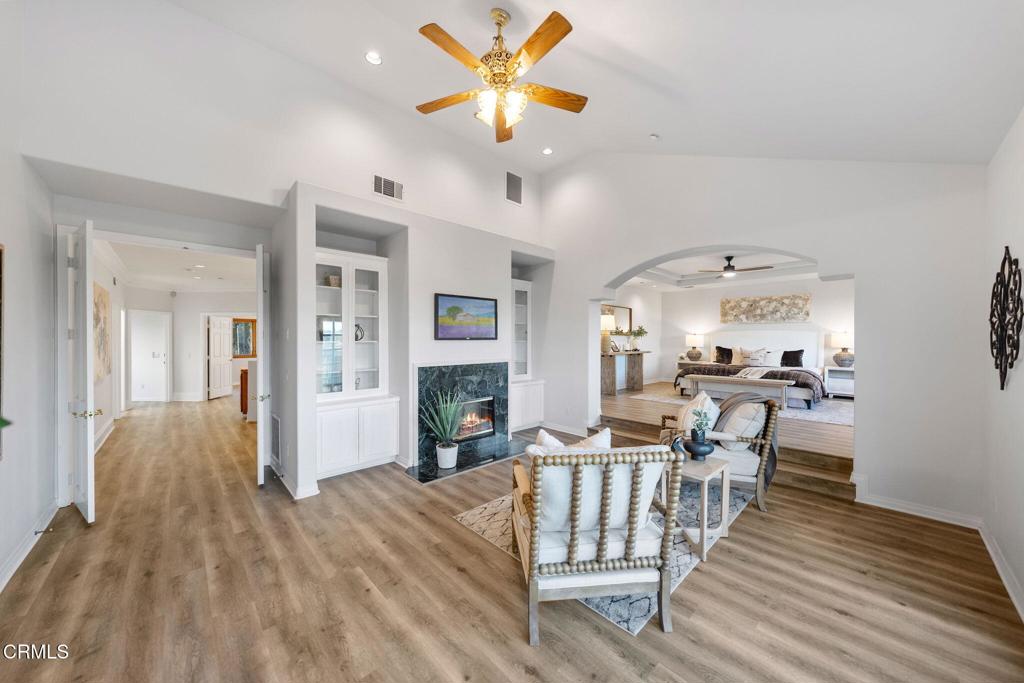 43650 Camaron Road Temecula, CA 92590 - Photo 35 of 52 a view of a livingroom with furniture a ceiling fan and wooden floor
