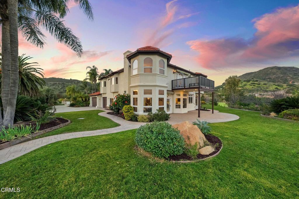 43650 Camaron Road Temecula, CA 92590 - Photo 46 of 52 a view of a house with a big yard plants and palm trees