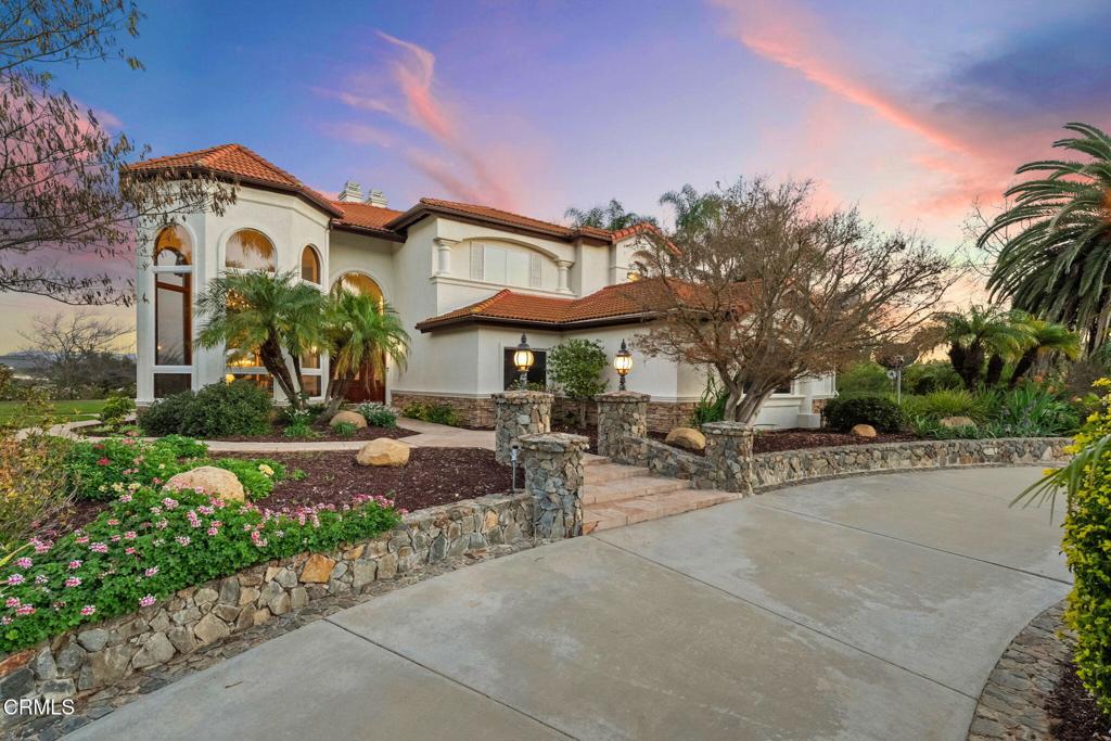 43650 Camaron Road Temecula, CA 92590 - Photo 5 of 52 a front view of a house with garden and patio