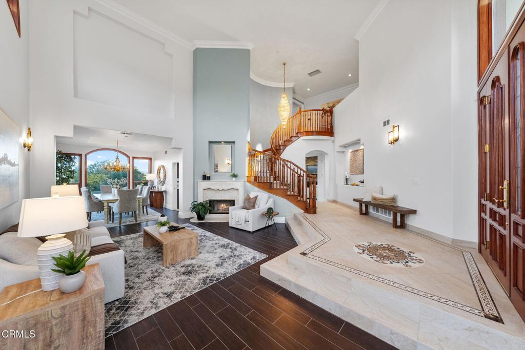43650 Camaron Road Temecula, CA 92590 - Photo 9 of 52 a living room with furniture and a chandelier