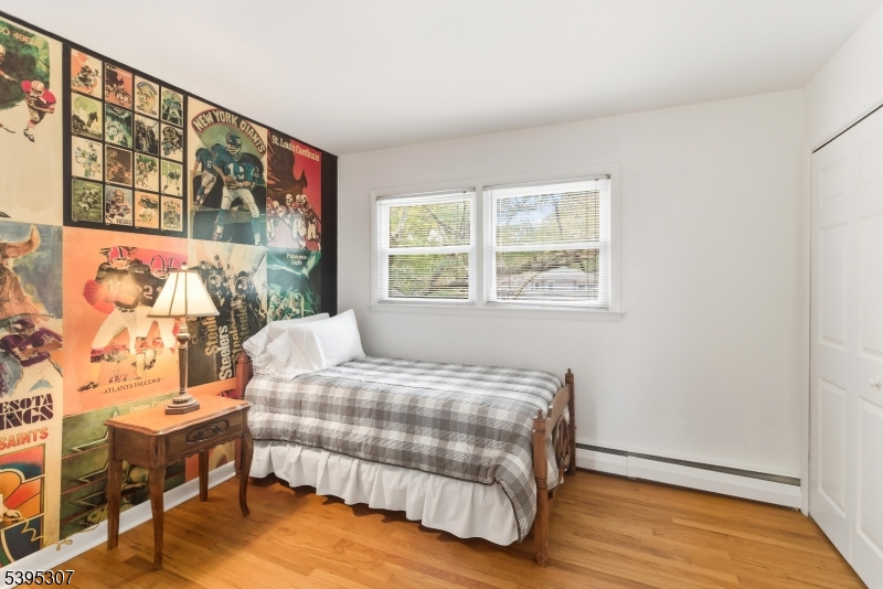 2286 Stocker Lane Scotch Plains, NJ 07076 - Photo 17 of 27 a bedroom with a bed and wooden floor