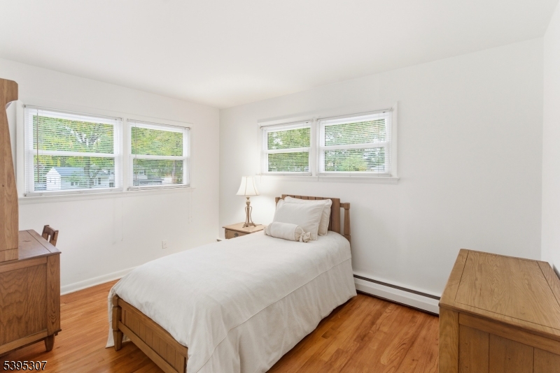 2286 Stocker Lane Scotch Plains, NJ 07076 - Photo 18 of 27 a bedroom with a bed and a window