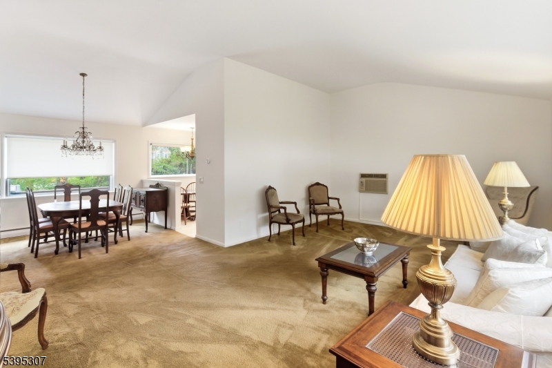 2286 Stocker Lane Scotch Plains, NJ 07076 - Photo 8 of 27 a living room with furniture a window and a dining table