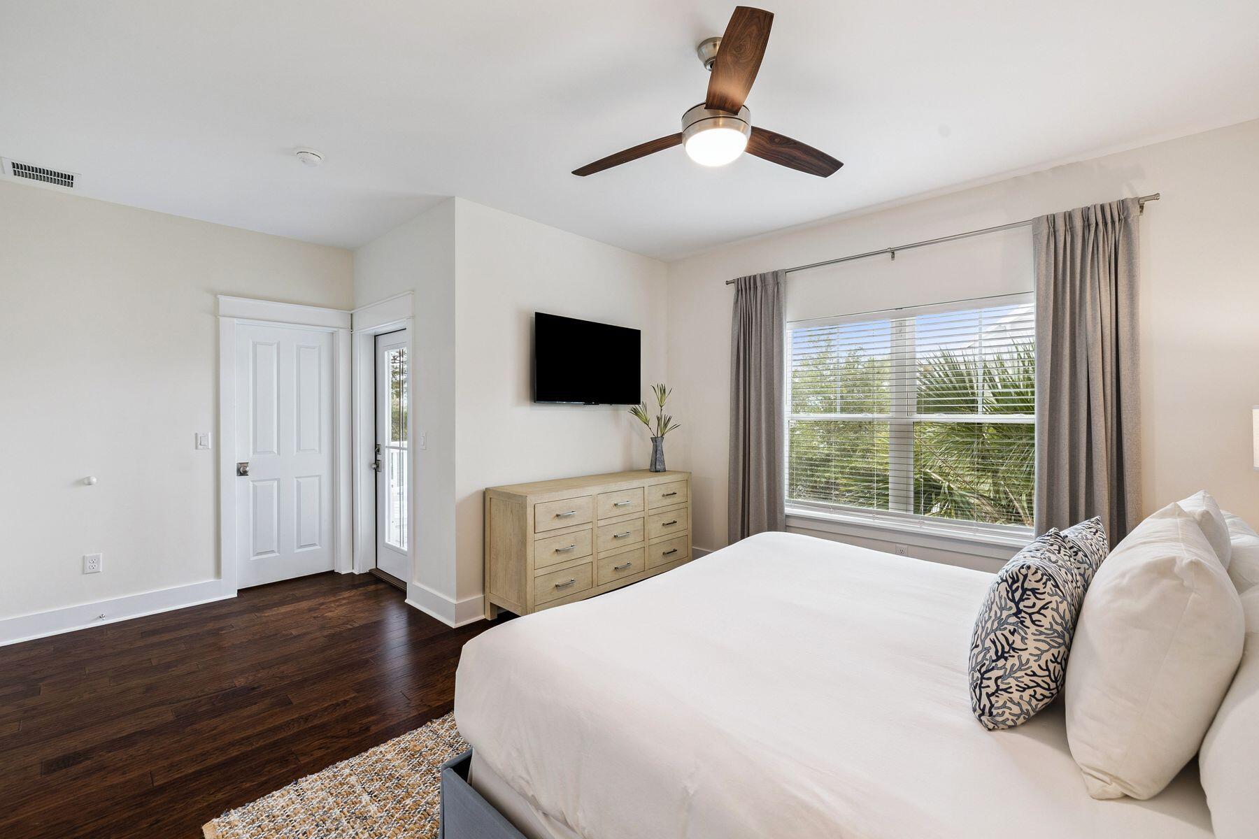 421 Gulfview Circle Santa Rosa Beach, FL 32459 - Photo 13 of 34 a spacious bedroom with a bed and a flat screen tv