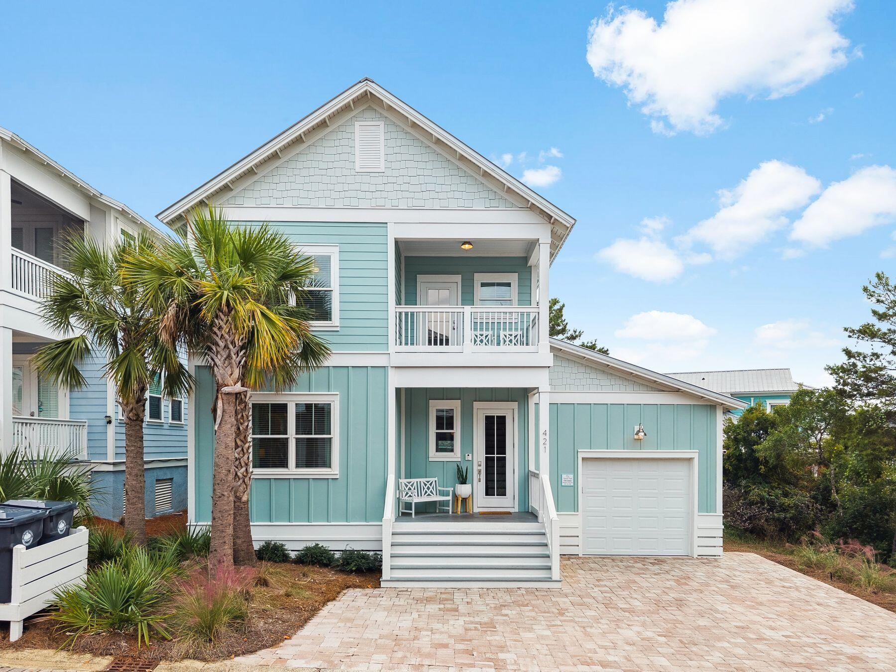 421 Gulfview Circle Santa Rosa Beach, FL 32459 - Photo 2 of 34 a front view of a house with a garden