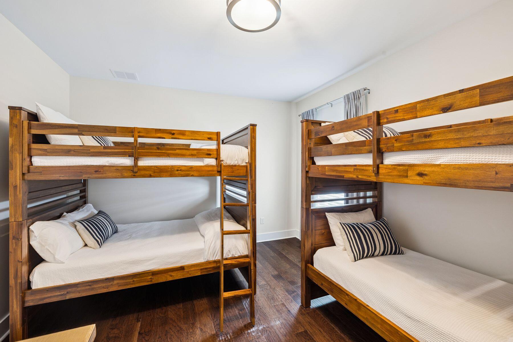 421 Gulfview Circle Santa Rosa Beach, FL 32459 - Photo 23 of 34 a bedroom with a bed and wooden floor