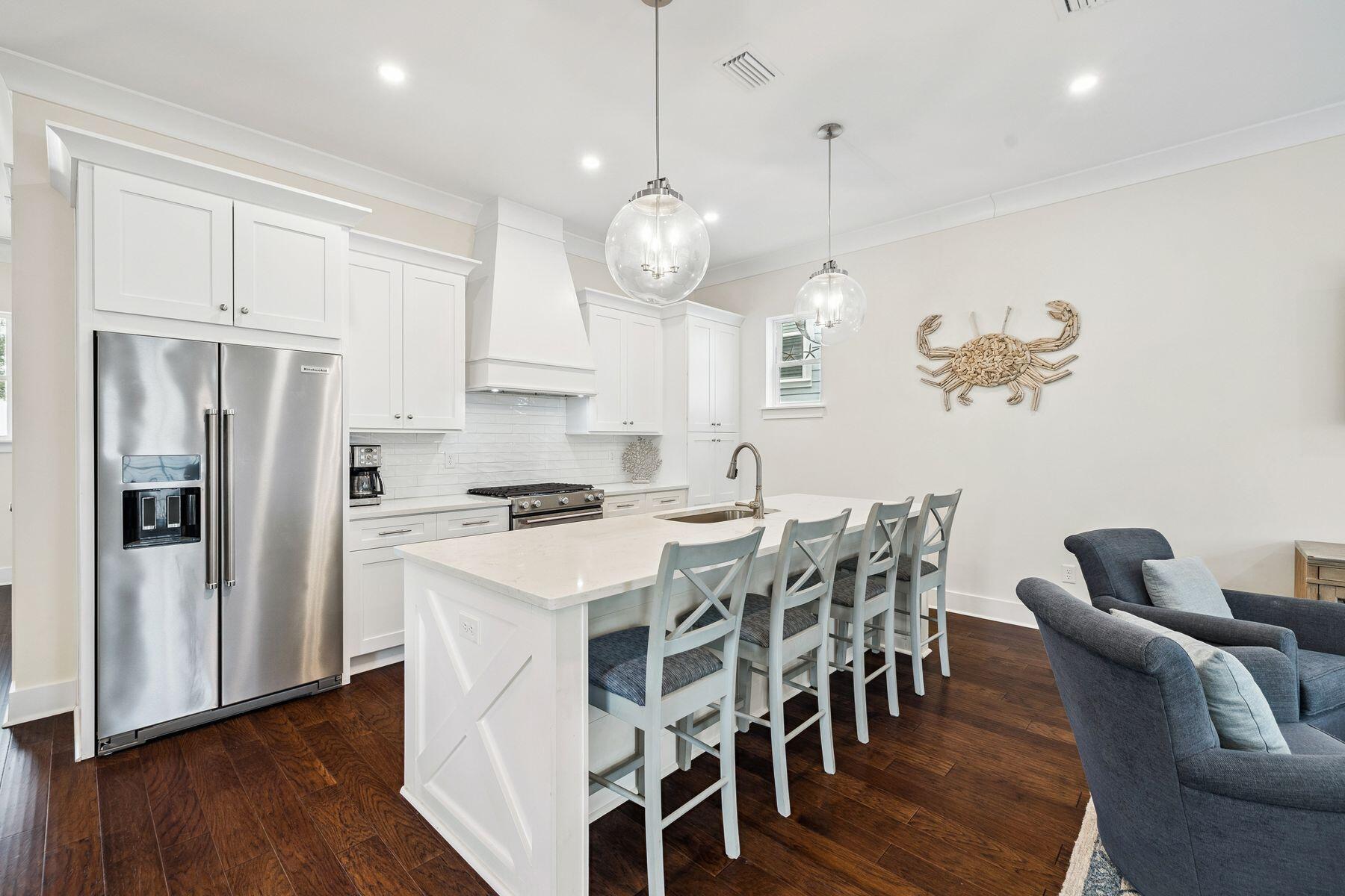 421 Gulfview Circle Santa Rosa Beach, FL 32459 - Photo 5 of 34 a view of kitchen with refrigerator a dining table and chairs