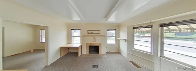 a view of a livingroom with a fireplace