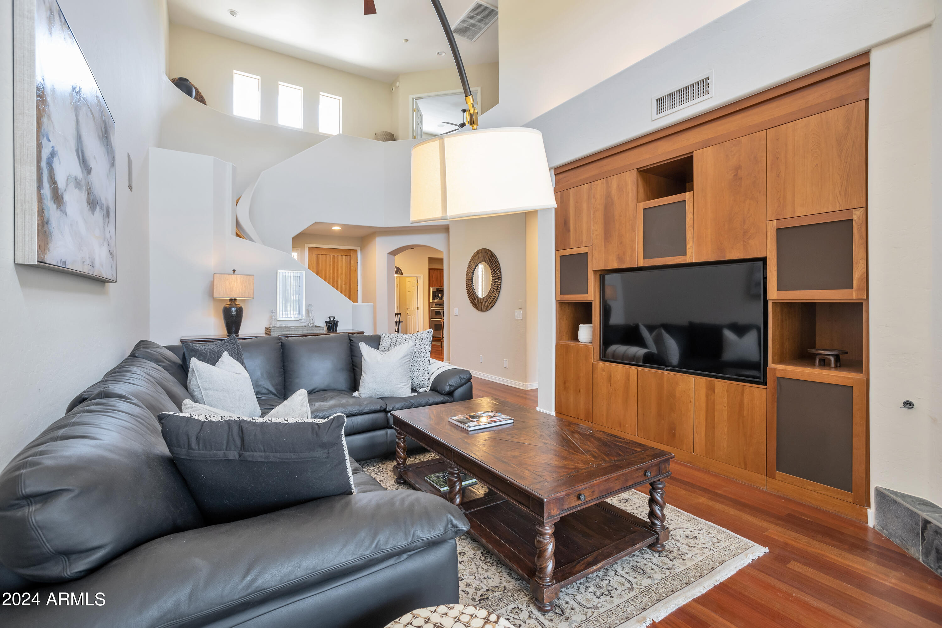 15240 North Clubgate Drive, Unit 150 Scottsdale, AZ 85254 - Photo 13 of 42 a living room with furniture and a flat screen tv
