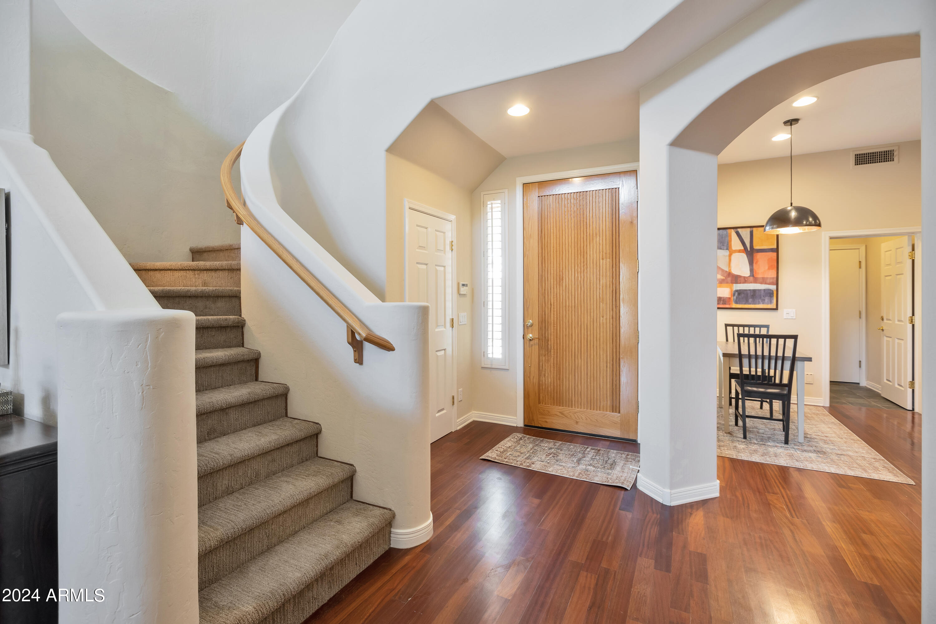 15240 North Clubgate Drive, Unit 150 Scottsdale, AZ 85254 - Photo 21 of 42 a view of entryway with wooden floor and stairs
