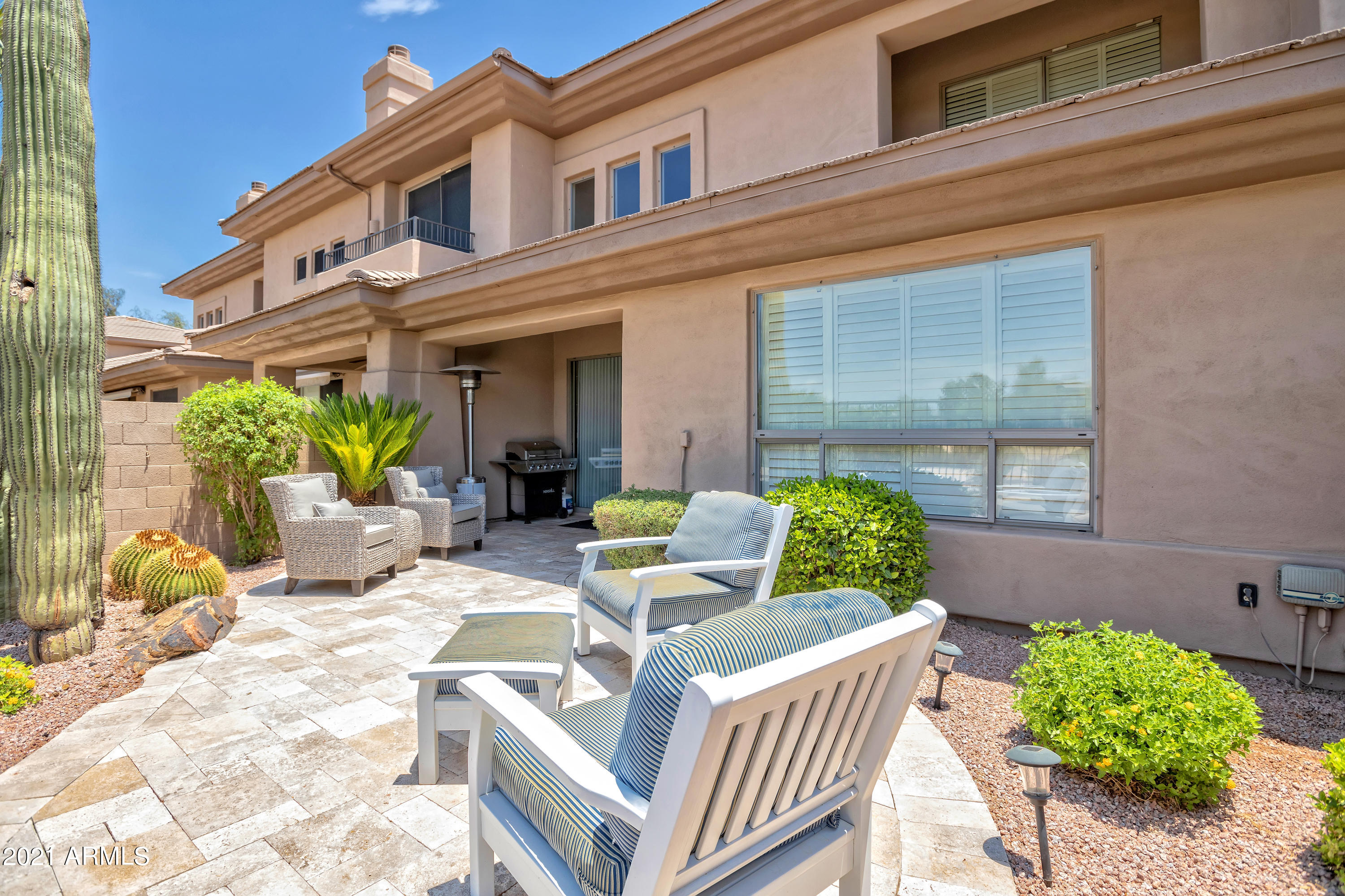 15240 North Clubgate Drive, Unit 150 Scottsdale, AZ 85254 - Photo 28 of 42 a view of a patio with couches table and chairs and potted plants