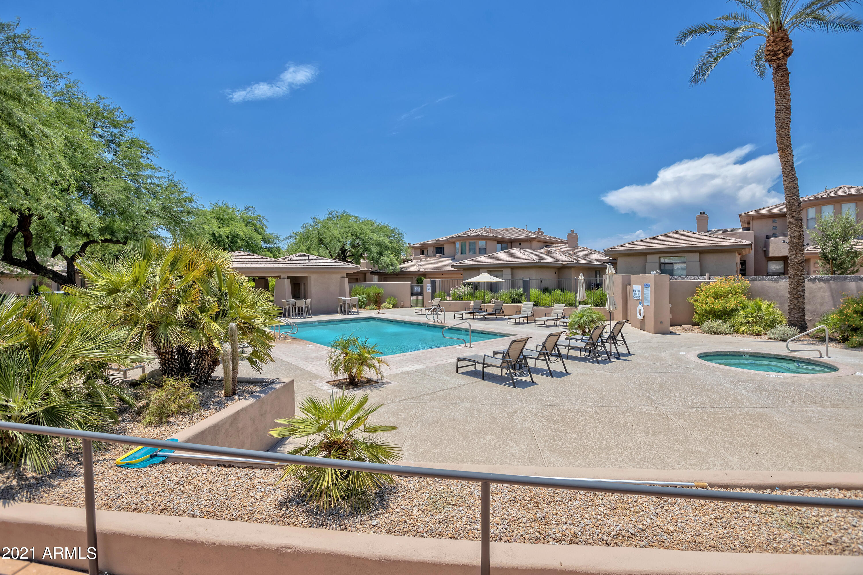 15240 North Clubgate Drive, Unit 150 Scottsdale, AZ 85254 - Photo 34 of 42 a view of yard with table and chairs and potted plants