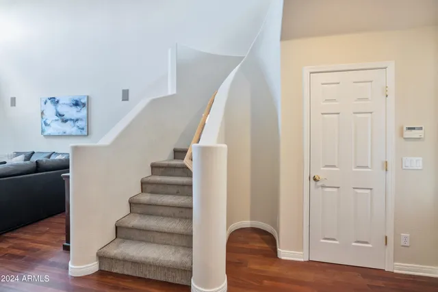 a view of entryway with wooden floor