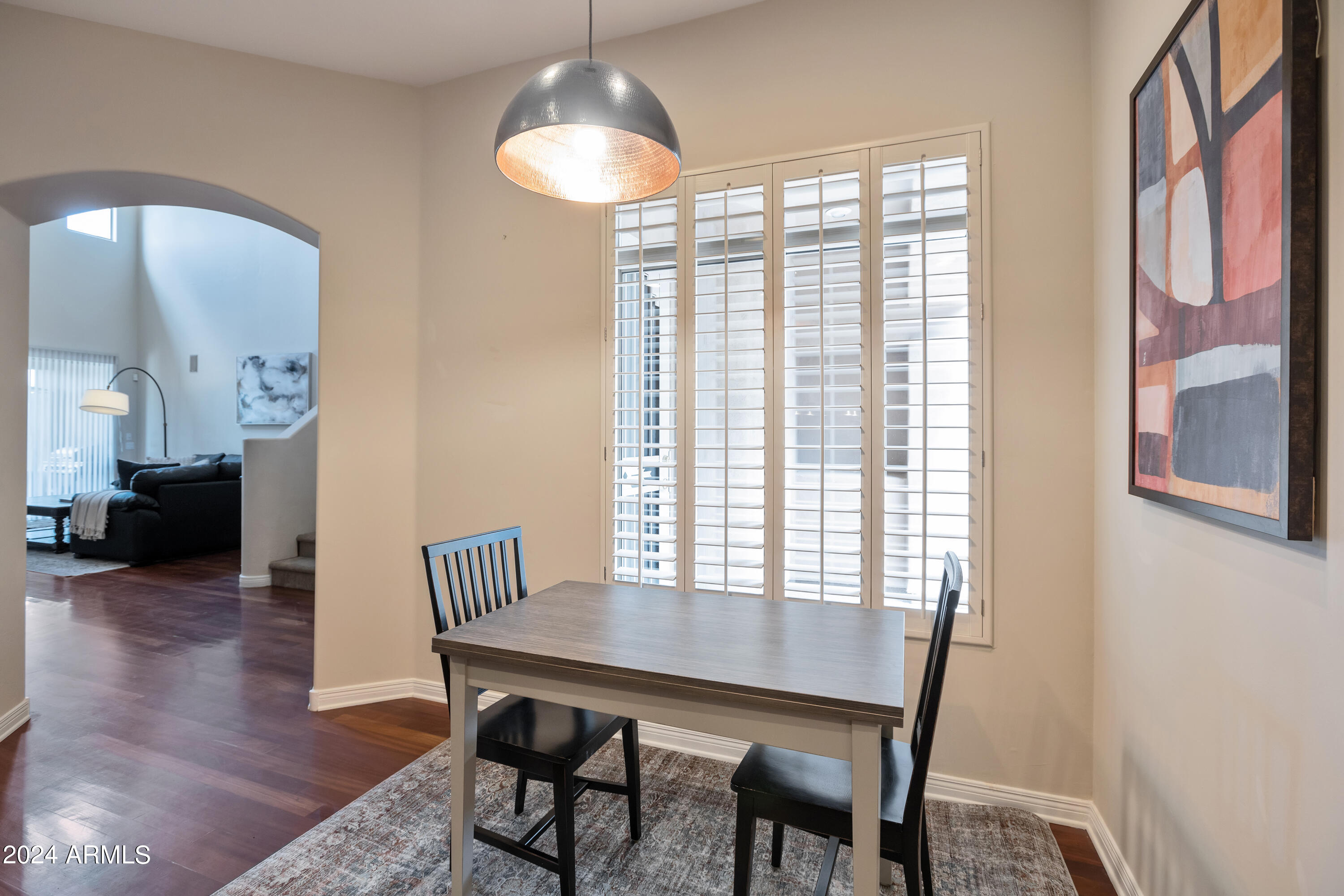 15240 North Clubgate Drive, Unit 150 Scottsdale, AZ 85254 - Photo 9 of 42 a view of a dining room with furniture window and wooden floor