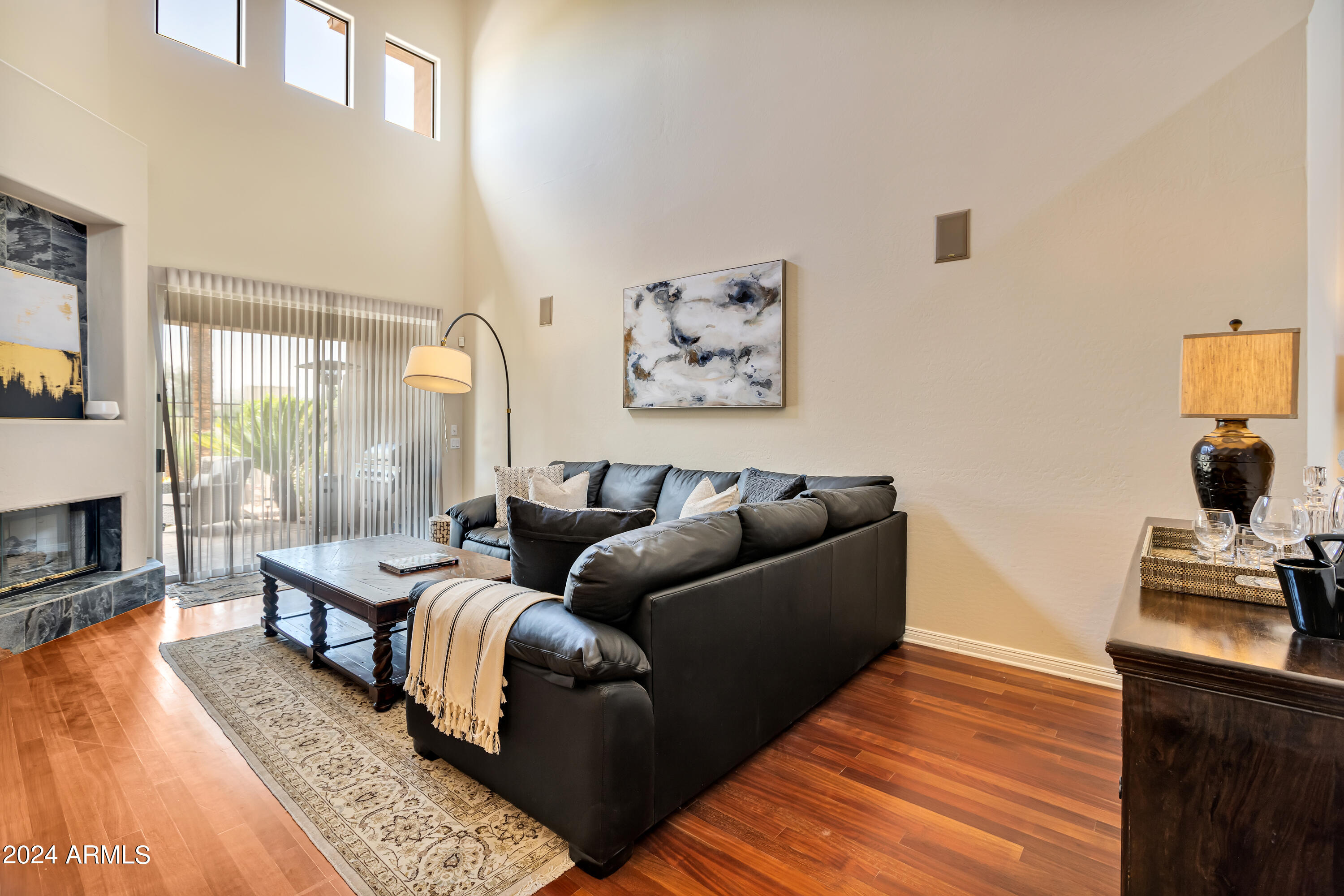 15240 North Clubgate Drive, Unit 150 Scottsdale, AZ 85254 - Photo 10 of 42 a living room with furniture and a fireplace