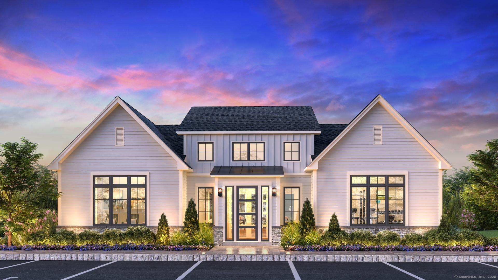 a front view of a house with garage