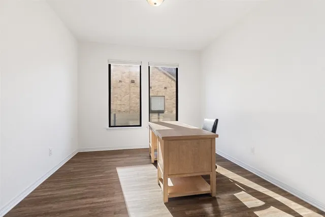 a workspace with wooden floor