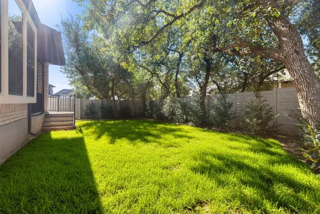 a swimming pool with outdoor seating and yard