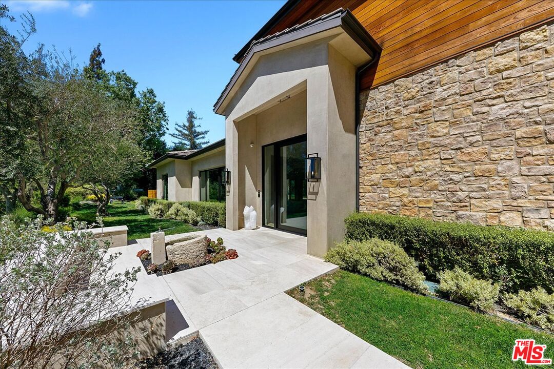 5757 Hoback Glen Road Hidden Hills, CA 91302 - Photo 13 of 41 a front view of a house with a yard