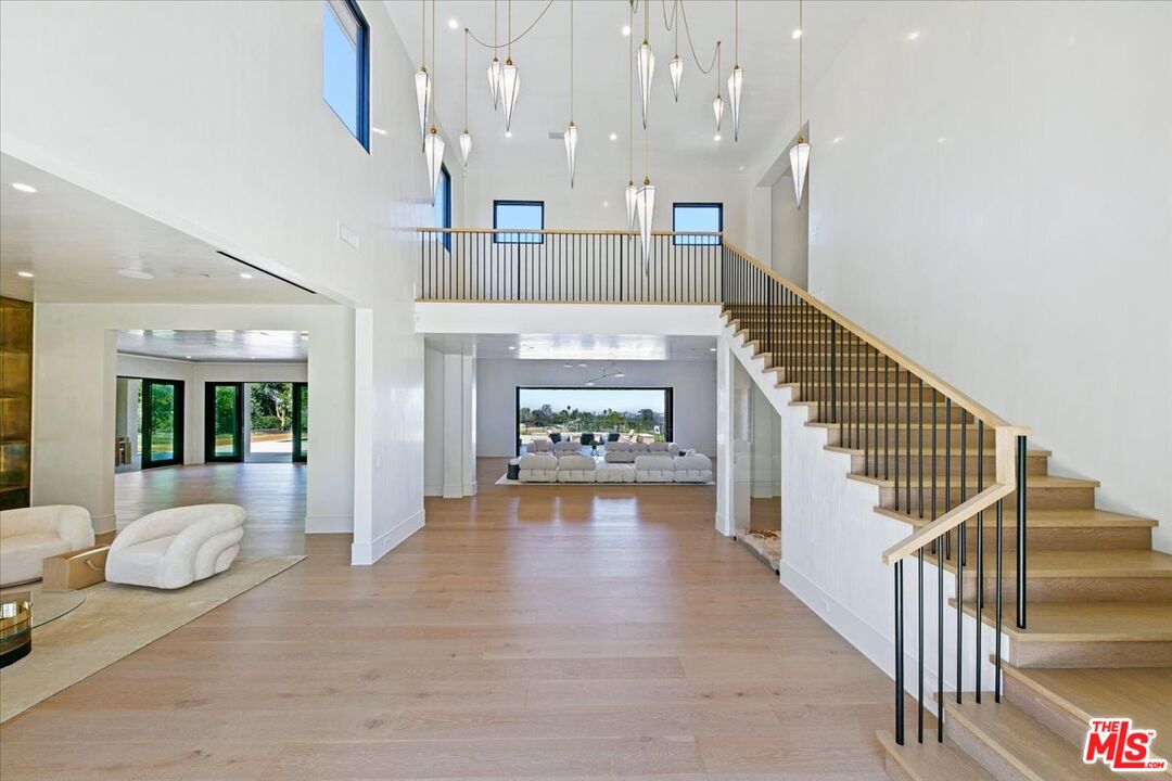 5757 Hoback Glen Road Hidden Hills, CA 91302 - Photo 14 of 41 a view of entryway and hall with wooden floor