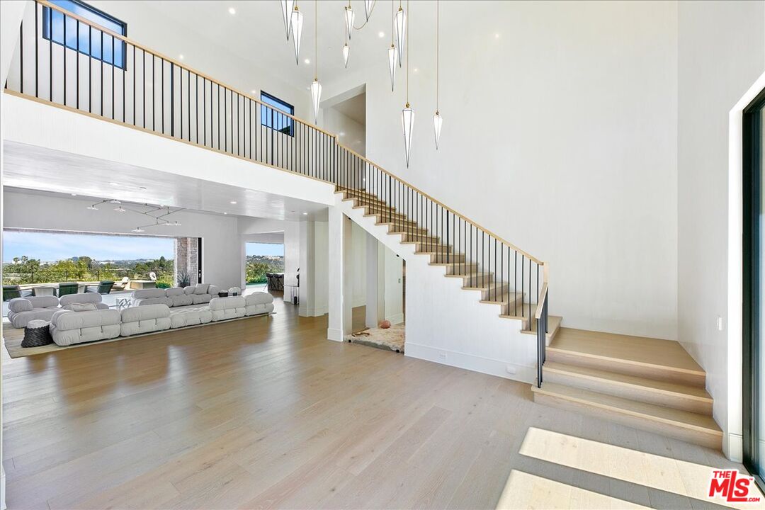 5757 Hoback Glen Road Hidden Hills, CA 91302 - Photo 15 of 41 a view of entryway and hall with wooden floor