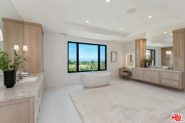 a view of a room with furniture and a potted plant