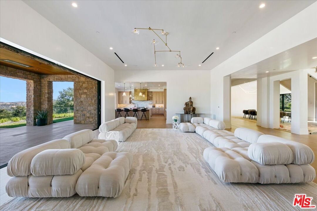 5757 Hoback Glen Road Hidden Hills, CA 91302 - Photo 24 of 41 a living room with furniture and a large window