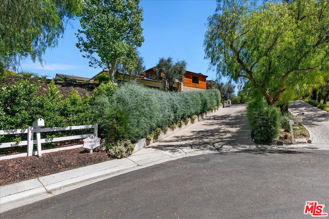 5757 Hoback Glen Road Hidden Hills, CA 91302 - Photo 38 of 41 a view of street with flower on side of it