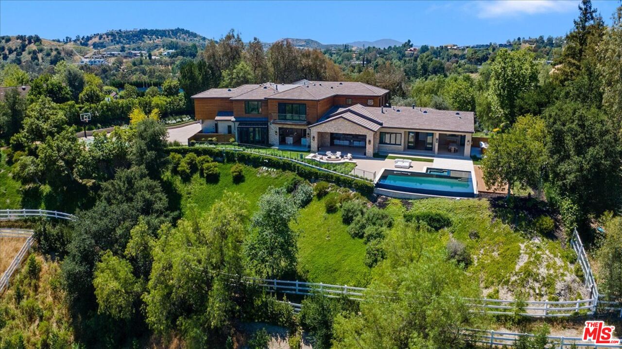 5757 Hoback Glen Road Hidden Hills, CA 91302 - Photo 40 of 41 an aerial view of a house with a garden