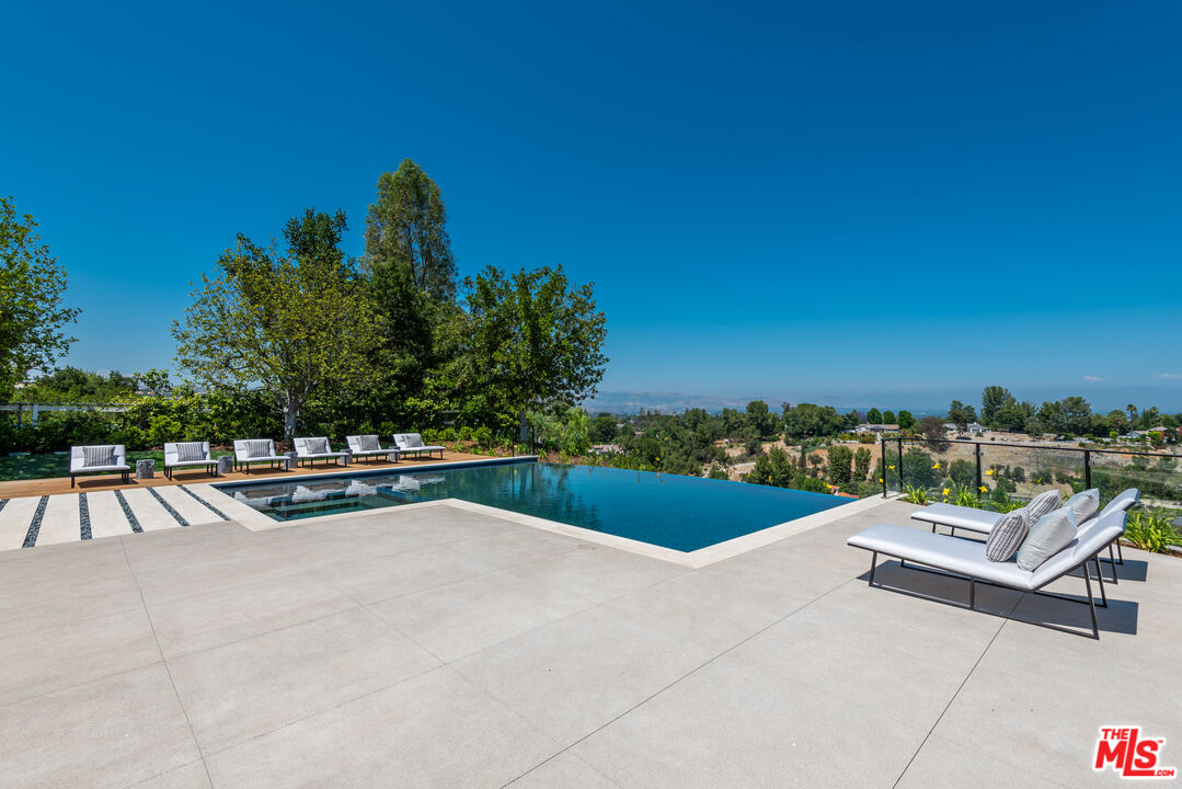5757 Hoback Glen Road Hidden Hills, CA 91302 - Photo 5 of 41 a view of swimming pool from a terrace