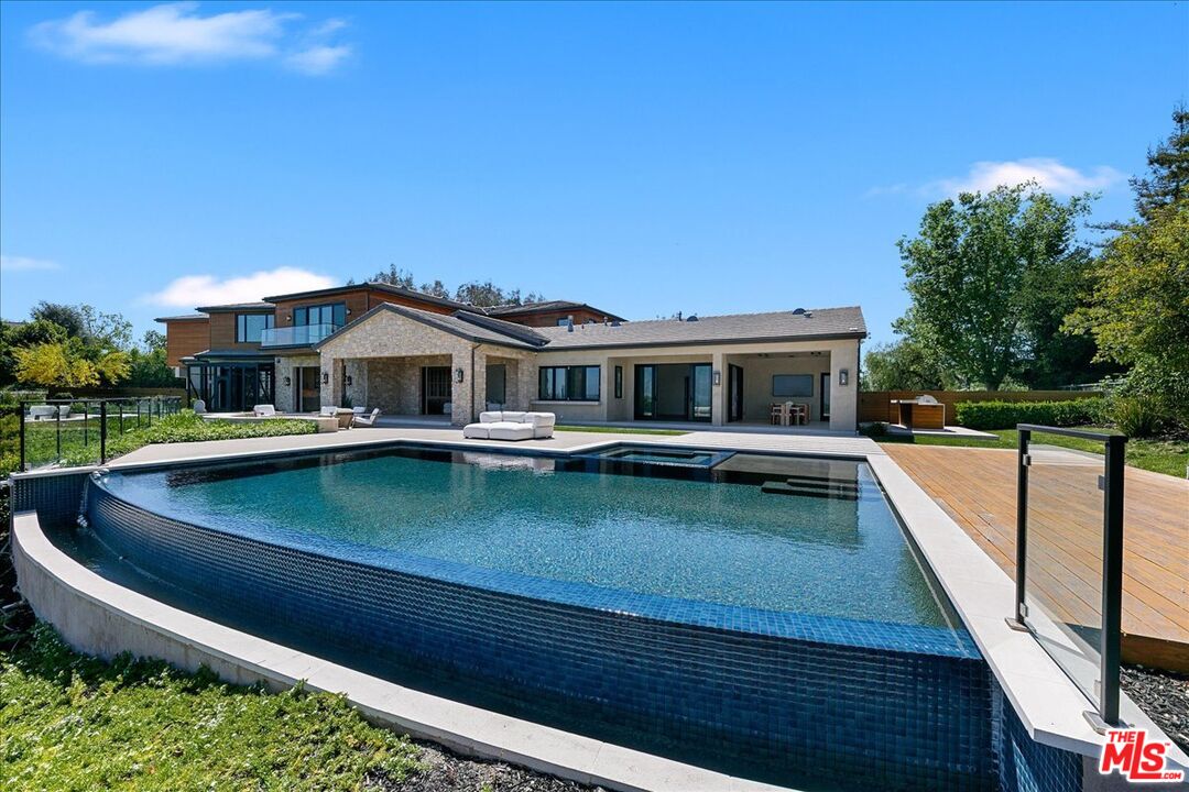 5757 Hoback Glen Road Hidden Hills, CA 91302 - Photo 7 of 41 a view of a house with pool