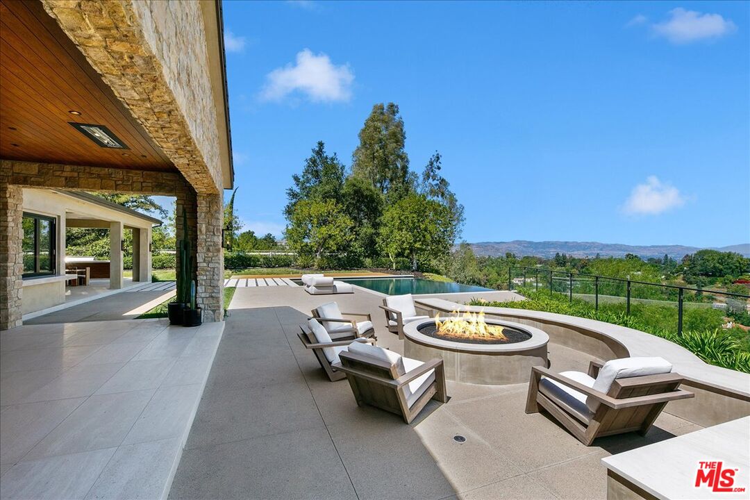 5757 Hoback Glen Road Hidden Hills, CA 91302 - Photo 10 of 41 a view of swimming pool with outdoor seating and couches