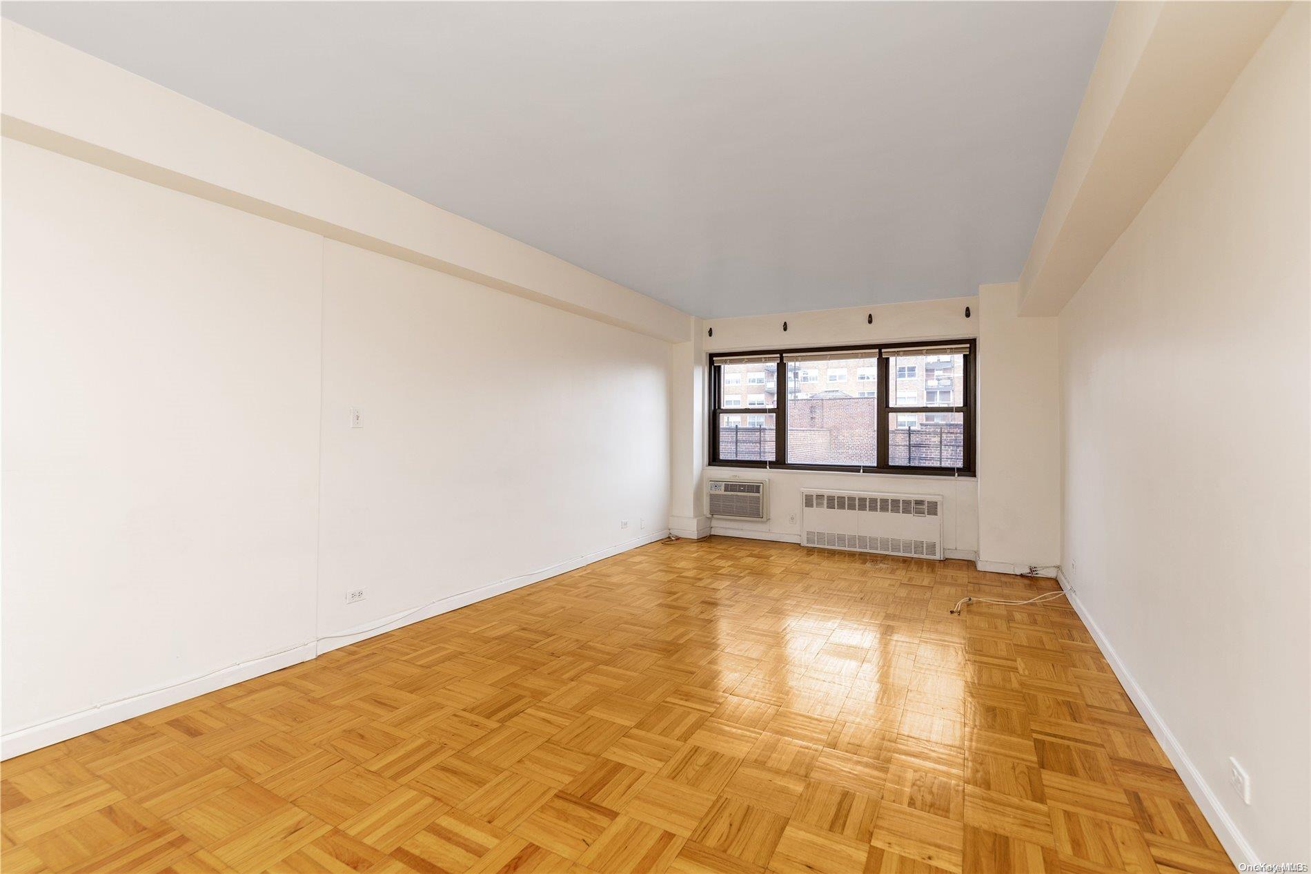 109-33 71st Road, Unit 7B Queens, NY 11375 - Photo 4 of 14 a view of an empty room with a window