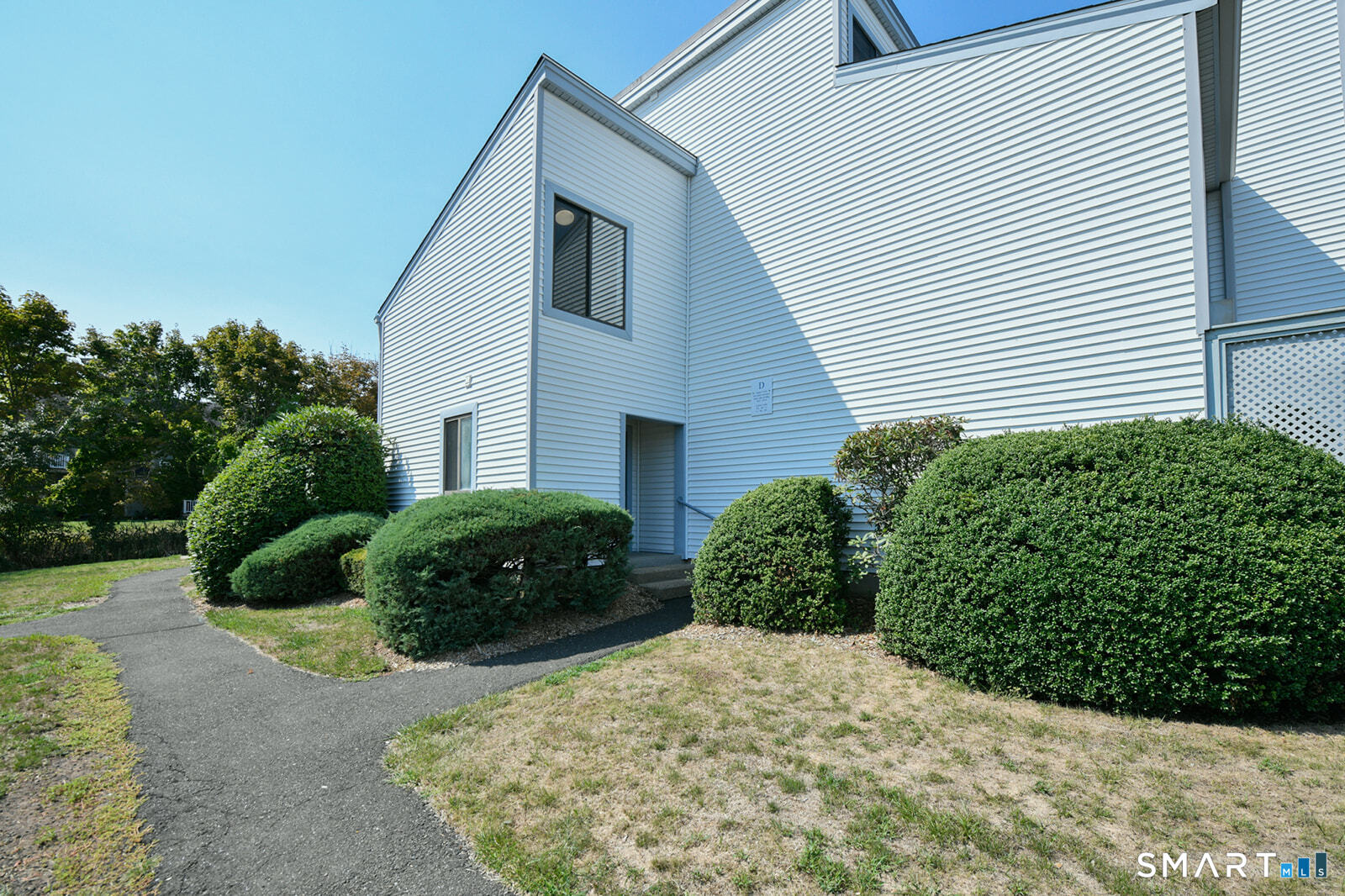 2 Hamre Lane, Unit D Branford, CT 06405 - Photo 17 of 18 a view of a house with a garden