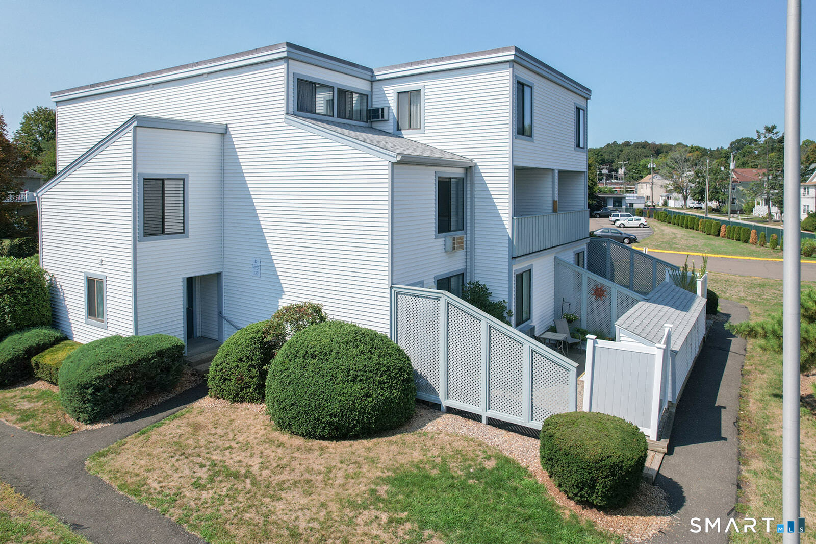 2 Hamre Lane, Unit D Branford, CT 06405 - Photo 2 of 18 a view of backyard with outdoor seating and plants