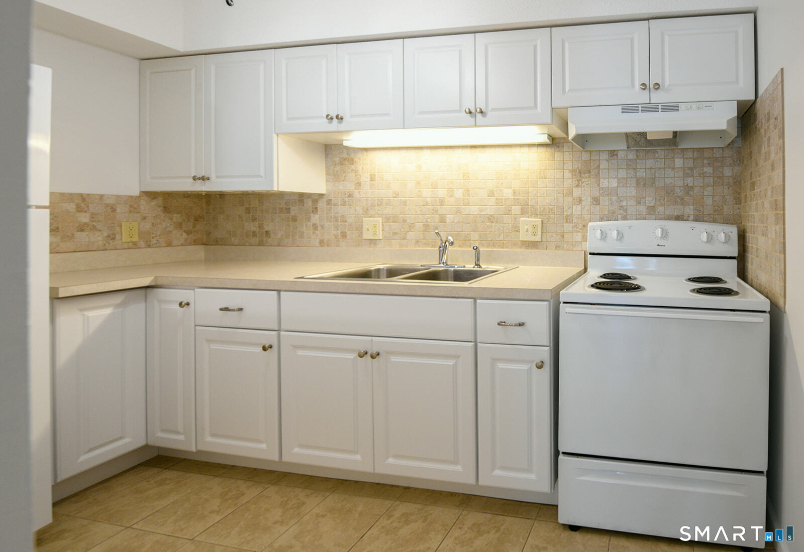 2 Hamre Lane, Unit D Branford, CT 06405 - Photo 9 of 18 a kitchen with appliances cabinets and a sink