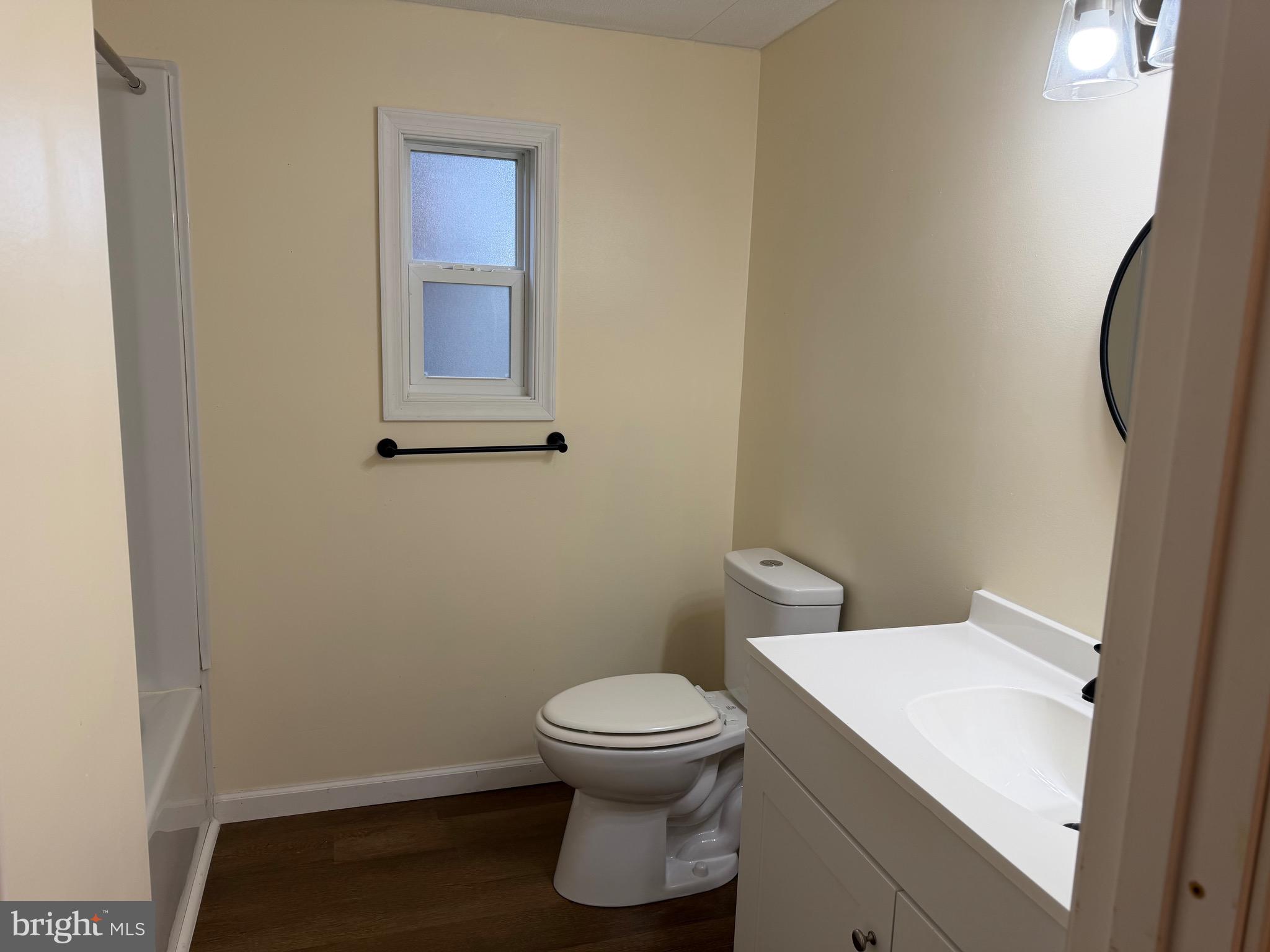 1104 West Elm Avenue Hanover, PA 17331 - Photo 12 of 13 a bathroom with a toilet and a mirror